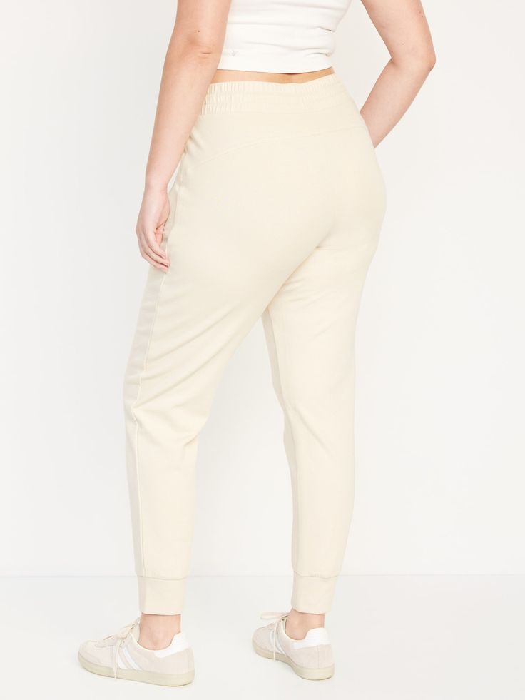 elastic-drawstring waist faux fly zippered hip pockets cuffed leg sits at belly button semi-fitted hip and thigh slim leg 27 1/2" regular inseam 25 1/2" petite inseam 30 1/2" tall inseam models are approx.  5'9" and wear sizes s (4), l (12), and xl (18) Sporty Relaxed Fit Pull-on Bottoms, Relaxed Fit Bottoms With Elastic Waistband And Tapered Leg, Elevated Casual Full-length Bottoms With Side Pockets, Comfortable Elevated Casual Bottoms, Elevated Casual Solid Pull-on Bottoms, Sporty Mid-rise Bottoms For Loungewear, Mid-rise Bottoms With Side Pockets For Loungewear, Elevated Casual Bottoms With Relaxed Fit, Relaxed Fit Bottoms For Elevated Casual Wear