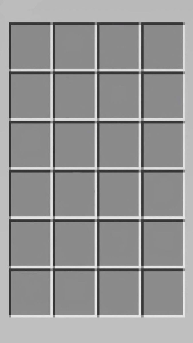 a gray and white photo frame with squares on the bottom, in front of a grey background