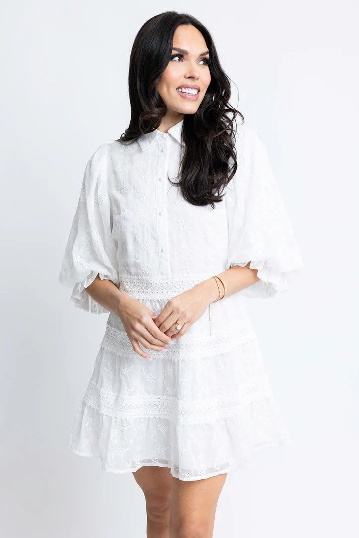 This eyelet lace dress exudes sophistication with its unique lace design and elegant button-up detail. Its classy look is further enhanced by its lining, making it a stylish choice for any occasion. But especially for Graduations! True to size Model is wearing small Color: white Button front detail Bubble Sleeves Back Zip Closure Lined Fabric has no stretch Polyester Eyelet Lace Dress, Floral Dress Casual, Black Short Dress, White Maxi, White Eyelet, Eyelet Lace, Dressy Casual, Dress With Cardigan, White Maxi Dresses