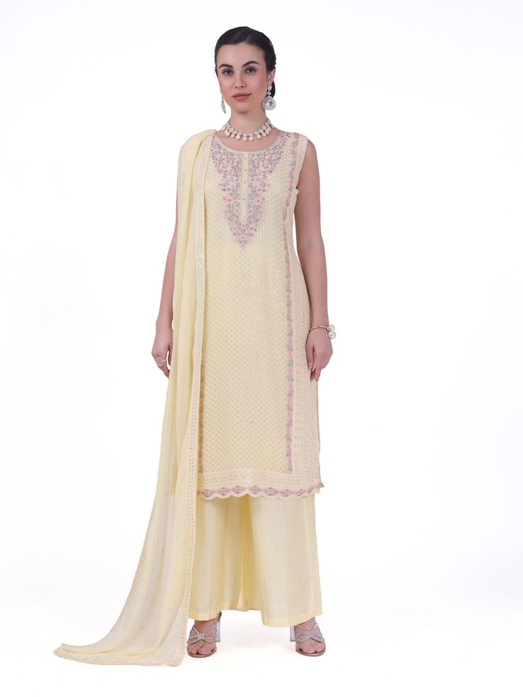 Arya Georgette Tiki Resham Embroidered Palazzo Suit. Readymade premium georgette fabric Enhanced with tiki & resham embroidery work Comes with dupatta, palazzo pants Sleeves attached as per image. Experience elegance and comfort with our Arya Palazzo Suit. Made with high-quality georgette fabric and featuring stunning Tiki Resham embroidery, this suit is perfect for any occasion. The palazzo pants provide a relaxed fit and added convenience. Yellow Chikankari Embroidered Sharara For Reception, Yellow Chikankari Embroidery Sharara For Reception, Festive Silk Palazzo Set With Chikankari Embroidery, Silk Palazzo Set With Straight Kurta For Reception, Silk Palazzo Set With Chikankari Embroidery For Reception, Unstitched Designer Palazzo Set With Cutdana Details, Palazzo Set With Straight Kurta For Navratri Reception, Yellow Embroidered Chinon Palazzo Set, Embroidered Yellow Chinon Palazzo Set