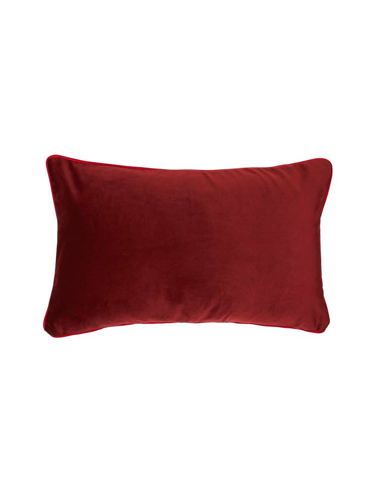 a red pillow on a white background