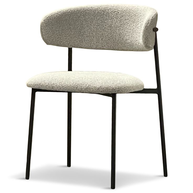 a white chair with black legs and an upholstered seat