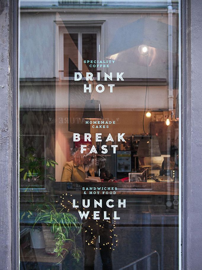 a window with the words drink hot and break fast on it