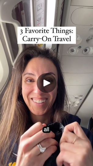 a woman is smiling while holding her cell phone in front of her face with the words 3 favorite things carry - on travel