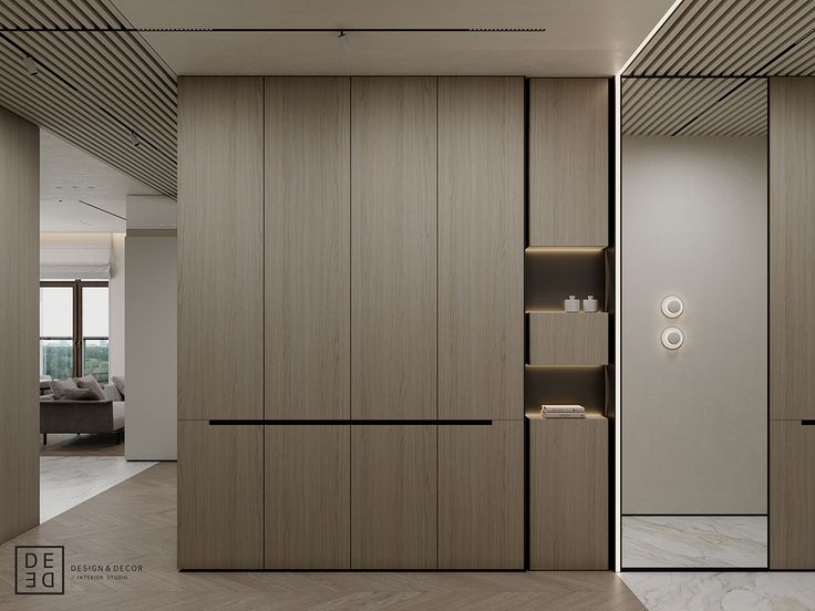 an open closet in a modern apartment with wood paneling and white marble flooring