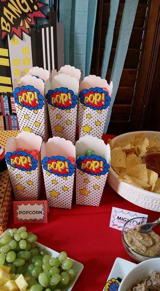 a table topped with plates of food and snacks