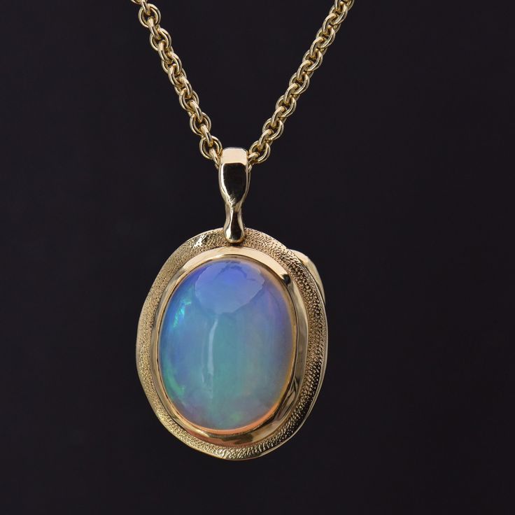 Details: 18k Yellow Gold Opal, 7.61 carat total weight Measurements: 20" chain included Finely crafted in New York, New York. Audrius Krulis' Biography & Collection can be found here. Please contact us for resizing options, special order inquiries, or any other questions. Yellow Gold Cabochon Round Pendant Jewelry, Formal Yellow Gold Cabochon Jewelry, Antique Yellow Gold Necklace With Cabochon, Exquisite Yellow Gold Cabochon Jewelry, Exquisite Oval Necklace With Large Pendant, Polished Oval Link Necklaces For Weddings, Oval Link Necklaces With Polished Finish For Weddings, Luxury Oval Pendant Necklace For Collectors, Formal Cabochon Pendant Necklace