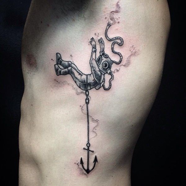 a man with an anchor tattoo on his chest is holding onto the rope that he has tied to