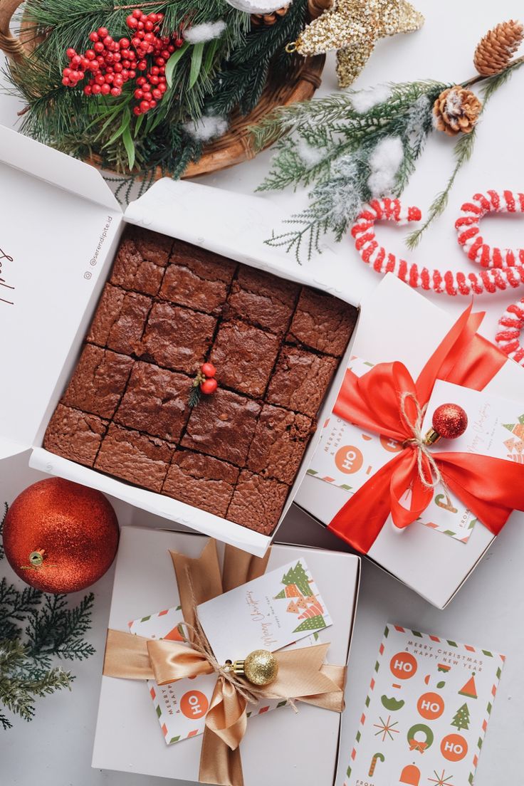 brownies in a white box surrounded by christmas decorations