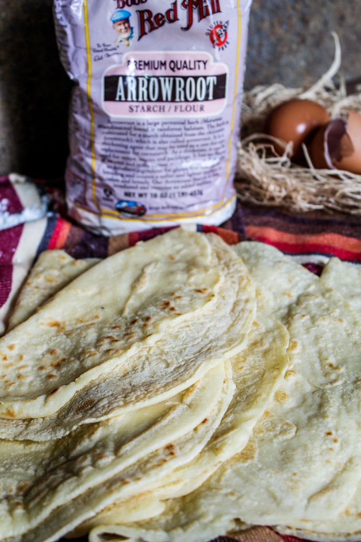 tortillas and eggs on a table with a bag of red mill flour in the background