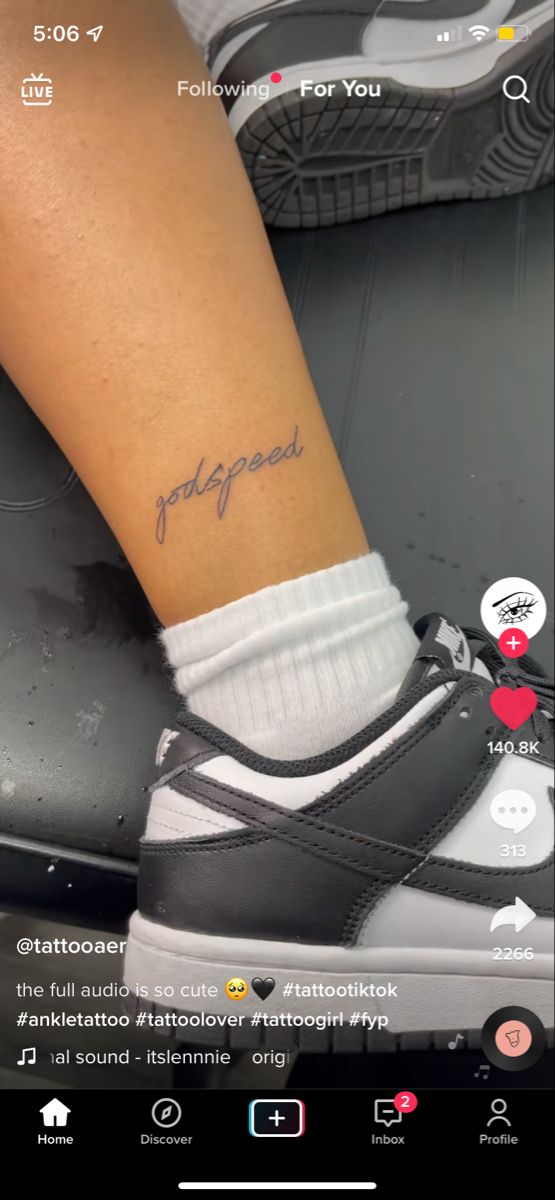 a person's foot with a tattoo that reads, i love you on it