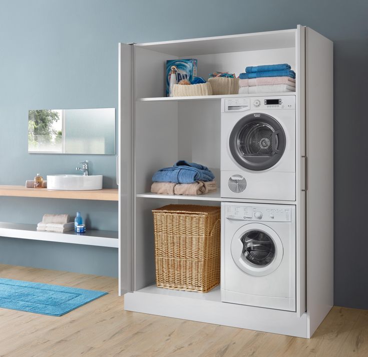 a washer and dryer sitting in a room next to each other on shelves