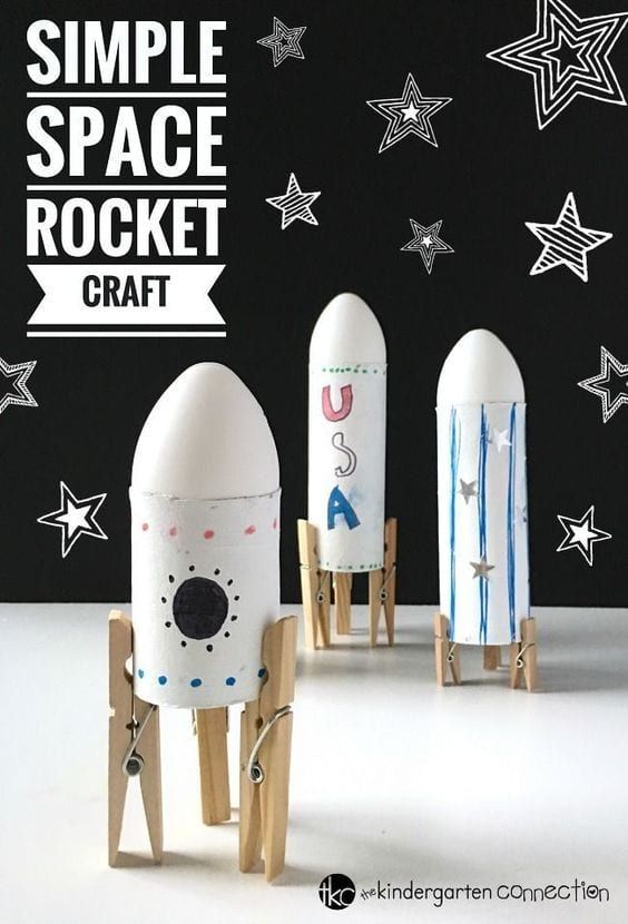 three small rockets sitting next to each other in front of a black and white background