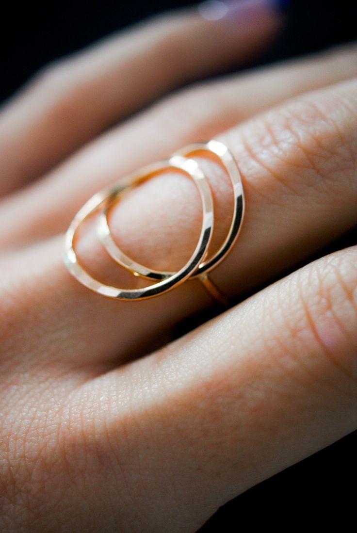 The Eclipse Ring is a new and even bolder version of the Circle Ring! To make the ring, we wrap two lengths of metal into a circular shape and lightly hammer it or leave the smooth, round finish. The hammered effect adds lots of shine and sparkle, so the ring has a big impact overall. We then connect a band around the back for a perfectly customized fit. This ring is incredibly easy to wear and very comfortable! This style is offered in 1.5mm metal an made from 14K Rose Gold Fill. Choose from a Rose Gold 14k Gold Circular Jewelry, Fine Jewelry Rose Gold Rings In Recycled Gold, Rose Gold Recycled Gold Open Ring, 14k Rose Gold Round Ring, Rose Gold 14k Round Ring, Modern Twist Rose Gold Ring, Modern Rose Gold Round Ring, Gold Open Ring In Rose Gold, Hammered Rose Gold Round Band Jewelry