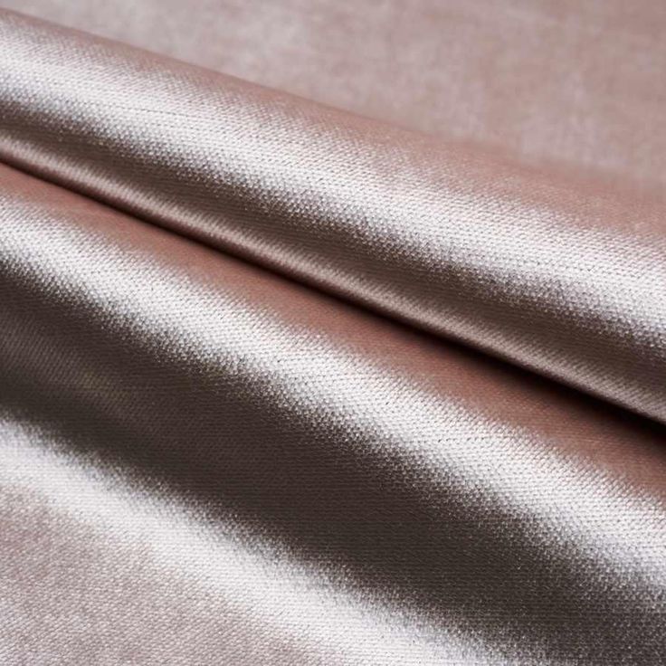 a close up shot of a pink and silver fabric