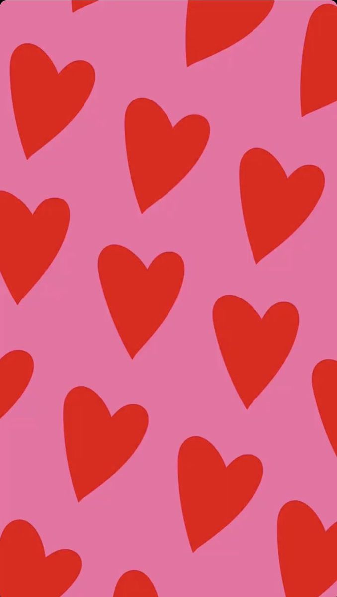 many red hearts on a pink background