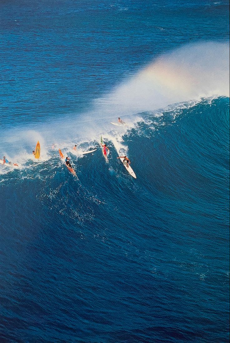 several surfers are riding the waves in the ocean