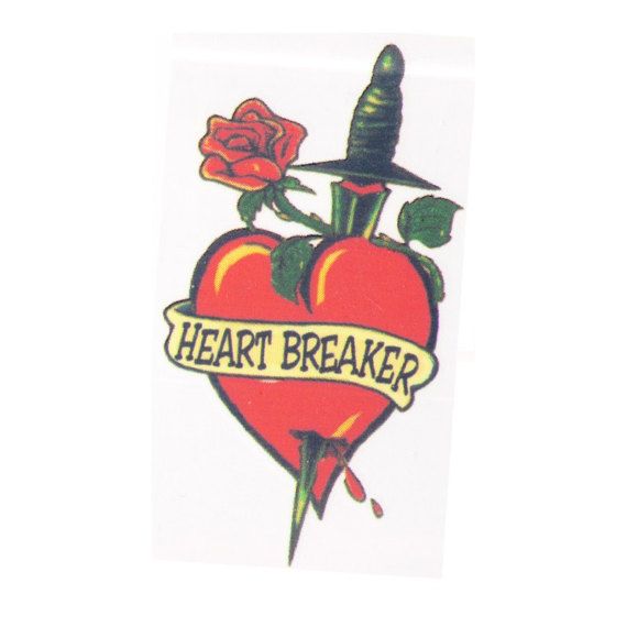 a heart with a dagger and rose on it that says,'heart breaker '