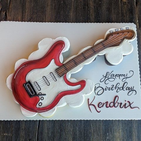 a birthday card with a red guitar on it