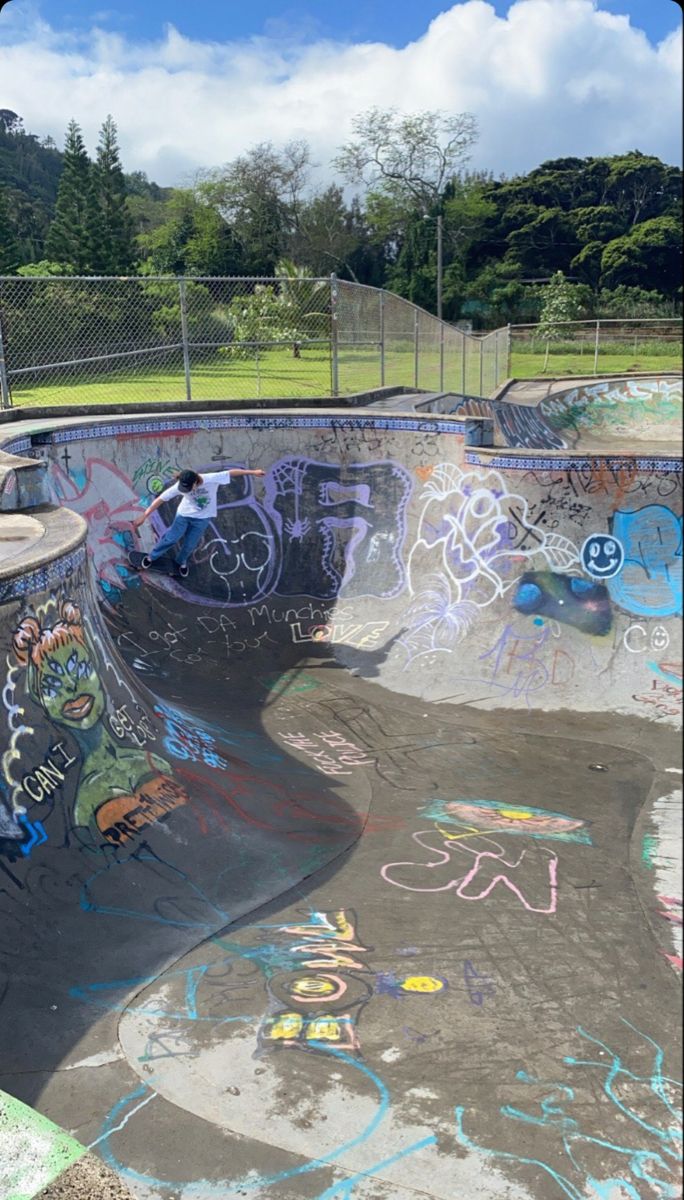 a skateboard park with graffiti all over it