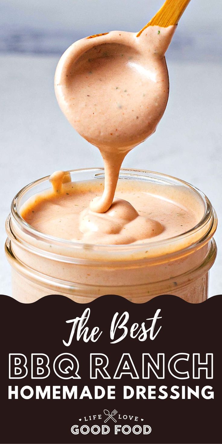 the best bbq ranch homemade dressing recipe in a jar with a spoon full of sauce