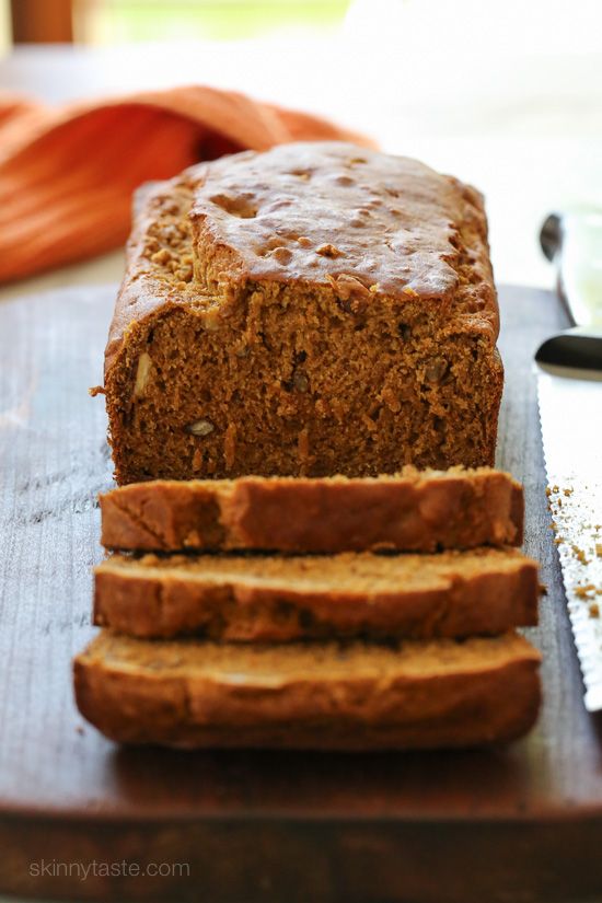 sliced loaf of banana bread sitting on top of a cutting board