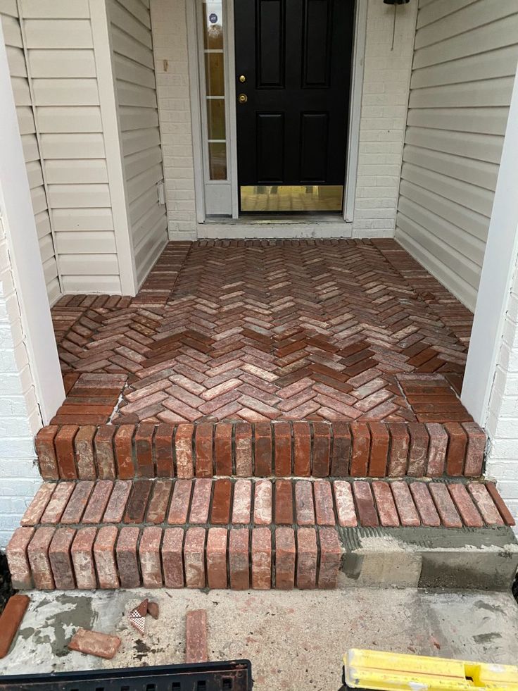 brick steps leading to the front door of a house