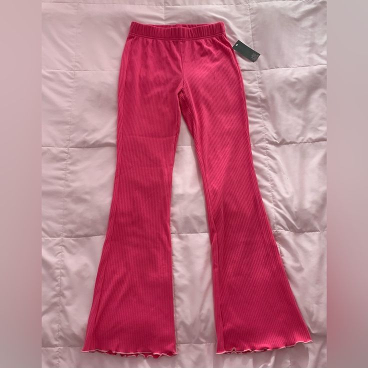 Ribbed Pajama Pants That Have Some Stretch To Them, Hot Pink With Light Pink Trim On The Bottom. Still Has Tag, Although Price Piece At The Bottom Was Taken Off! Pink Cotton Wide Leg Sleepwear, Trendy Pink Sweatpants For Lounging, Pink Stretch Sweatpants For Loungewear, Casual Bottoms With Elastic Waistband For Pajama Party, Casual Spring Bottoms For Pajama Party, Casual Pink Lounging Bottoms, Casual Pink Bottoms For Lounging, Casual Stretch Pink Bottoms, Trendy Pants For Pajama Party