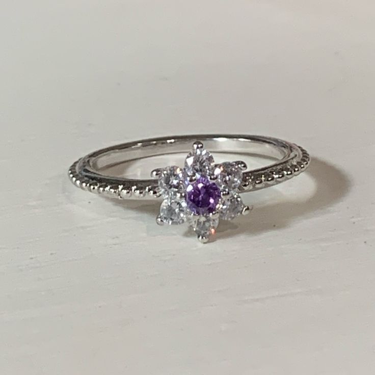 Amethyst Silver Birthstone Ring Size: 6.75 Silver Cubic Zirconia Birthstone Crystal Ring, Silver Crystal Ring With Birthstone, Cubic Zirconia, Silver Birthstone Crystal Ring With Cubic Zirconia, Amethyst Promise Ring With Stone Setting, Silver Amethyst Ring With Round Accent Stones, Crystal Amethyst Ring With Center Stone, Amethyst Crystal Ring With Center Stone, Dainty Silver Crystal Ring With Prong Setting, Silver Crystal Ring With Prong Setting