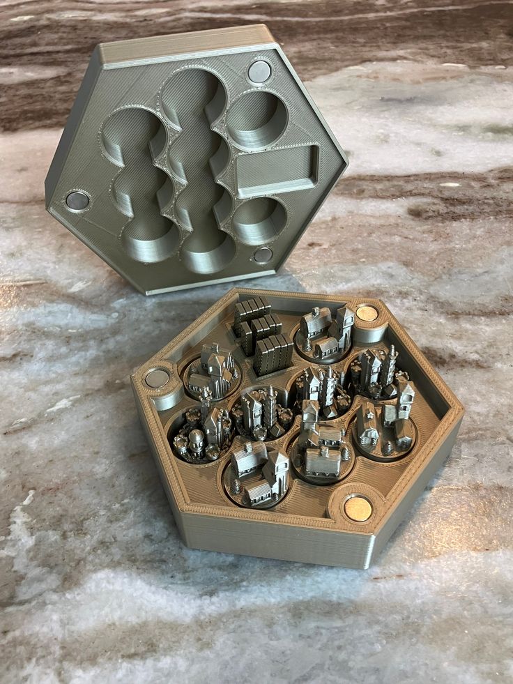 a cookie tin filled with lots of silver items