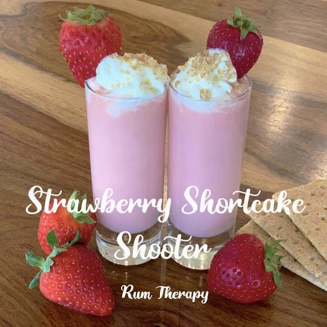 strawberry shortcake shooters with whipped cream and strawberries