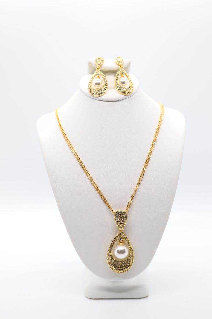 This necklace is made of gold and pearls. The gold chain is delicate, and the pearls are a lovely creamy white. The necklace comes with matching earrings, which are equally lovely. Gold And Pearl Necklace, Gold And Pearls, The Necklace, Gold Pearl Necklace, The Gold, Tennis Bracelet, Creamy White, Christmas Sale, Matching Earrings