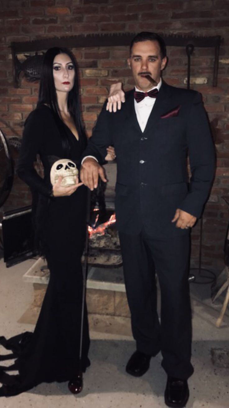 a man and woman dressed up for halloween