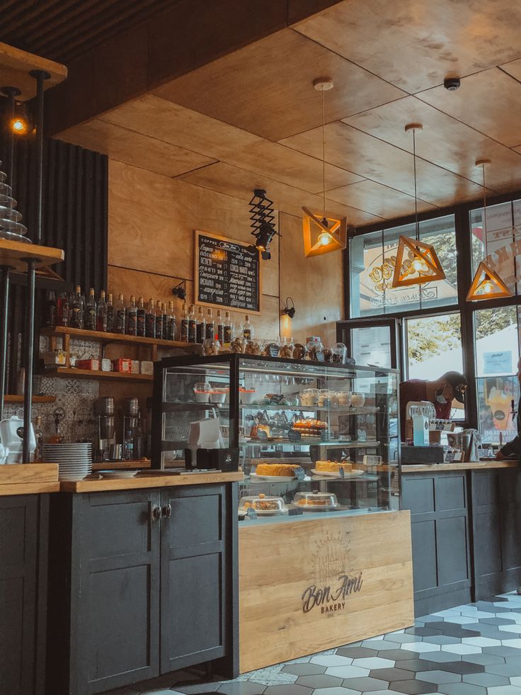 the inside of a coffee shop with lots of counter space