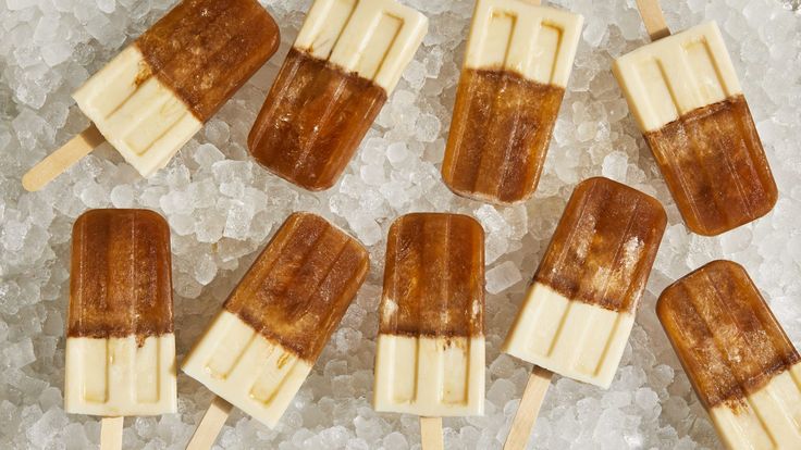 several popsicles with banana slices on top of ice