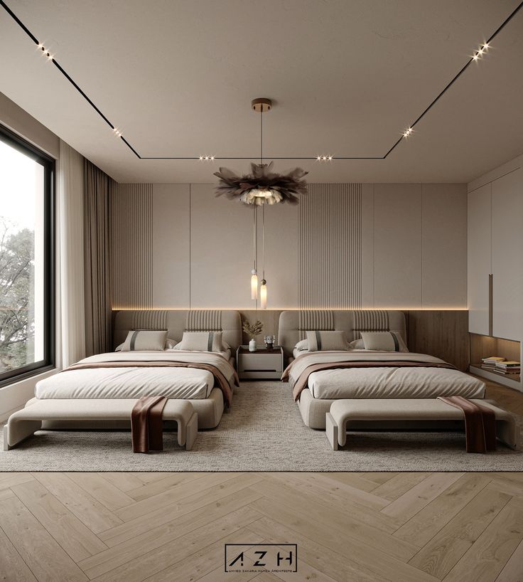 two beds in a room with large windows