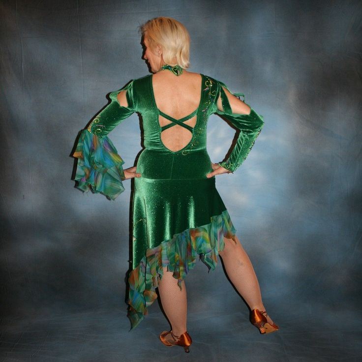 Purchase the whole Latin-Rhythm Dance set & SAVE more! Whole set is only $1600.00! Latin Rhythm dress on sale will fit size 7/8-11/12 best for a curvy ballroom dancer This gorgeous Latin-rhythm dress, crafted in luxurious emerald green glitter stretch velvet, radiates style and sophistication with its accent flounces of green print chiffon, one long right sleeve, 3/4 left sleeve with flounces, three peek-a-boo slits on each, and nude color stretch illusion cutout. Finishing touches of detailed S Green Fitted Dress For Ballroom, Green Fitted Ballroom Dress, Fitted Green Ballroom Dress, 1500 Dresses, Rhythm Dress, Tango Fashion, Orchid Print, Deep Emerald Green, Dancer Dress