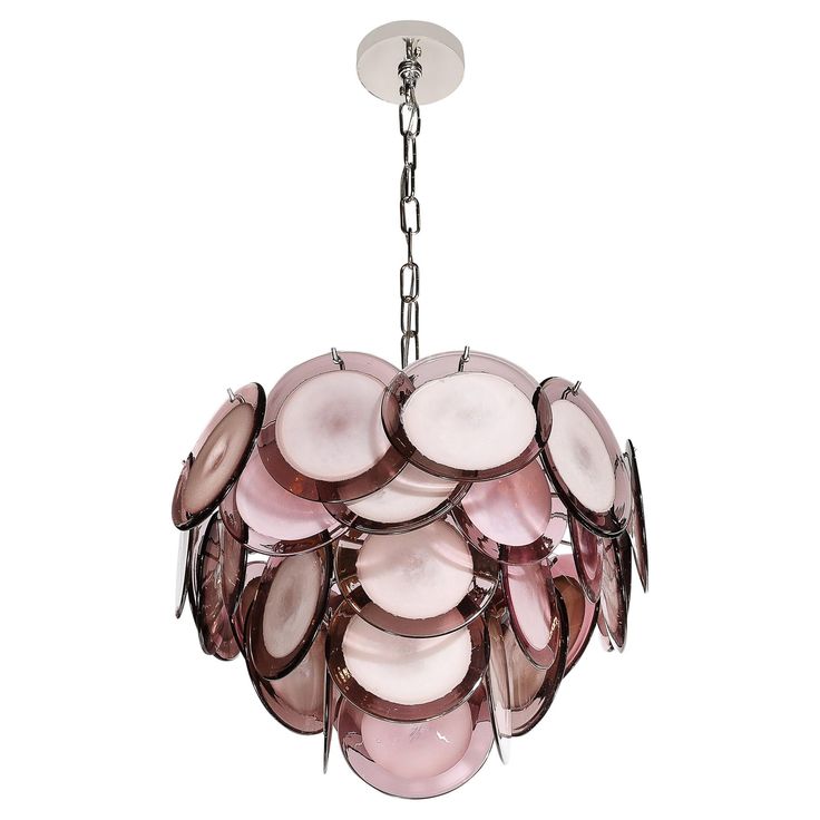 a pink chandelier hanging from a chain