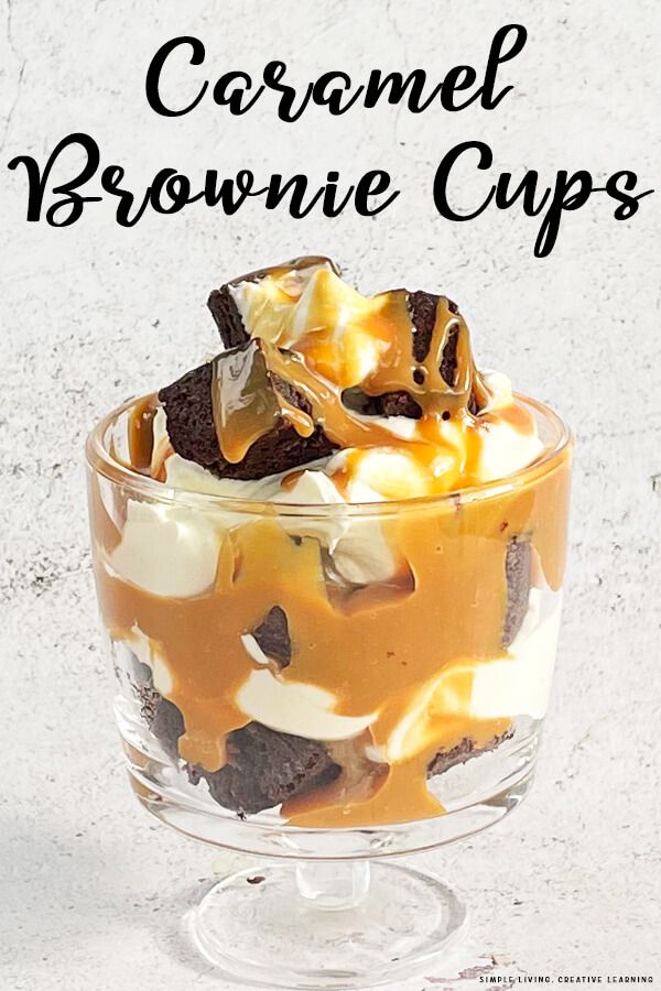 caramel brownie cups in a glass dish with chocolate chips and marshmallows