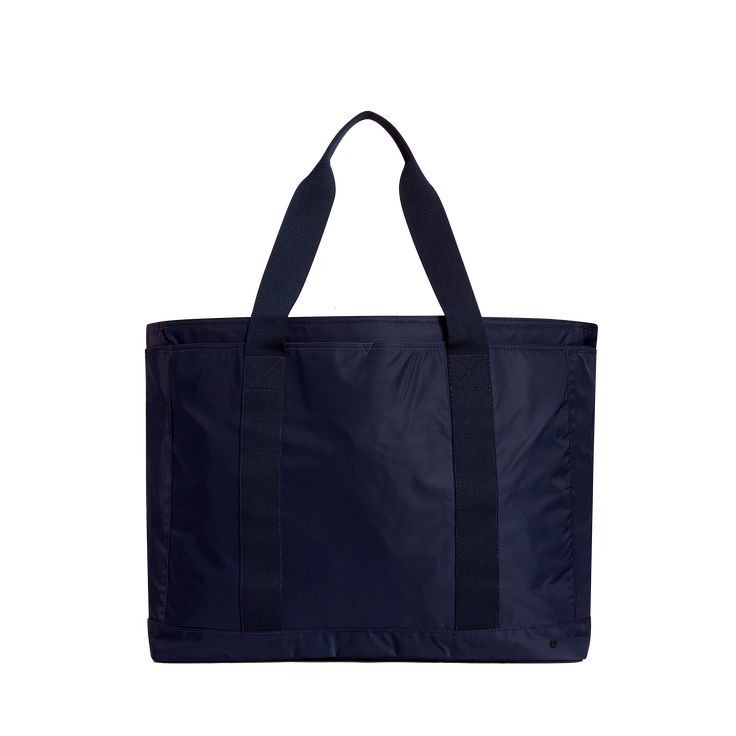 STATE Bags Wellington XL Tote Navy Front View Click to Zoom Large Capacity Nylon Bag For On-the-go, Navy Nylon Bags For On-the-go, Nylon Weekender Bag For Weekend Trips, Sporty Rectangular Weekender Bag For Weekend Trips, Sporty Rectangular Weekend Travel Bag, Large Capacity Nylon Tote Duffle Bag, Large Capacity Tote Weekender Bag For Weekend Trips, Practical Nylon Bags For Weekend Trips, Sporty Large Capacity Tote Luggage