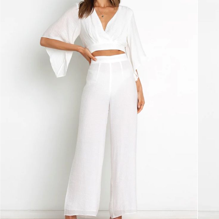 Brand New, Never Worn Chic White V-neck Sets, Chic High-waisted Summer Jumpsuits, White Long-sleeve Summer Pantsuit, White Long Sleeve Summer Pantsuit, White Long Sleeve Pantsuit For Summer, High-waisted Jumpsuits And Rompers For Summer, Elegant V-neck Beach Set, Chic High-waisted Jumpsuits For Day Out, Elegant Summer Sets With High-waisted Pants