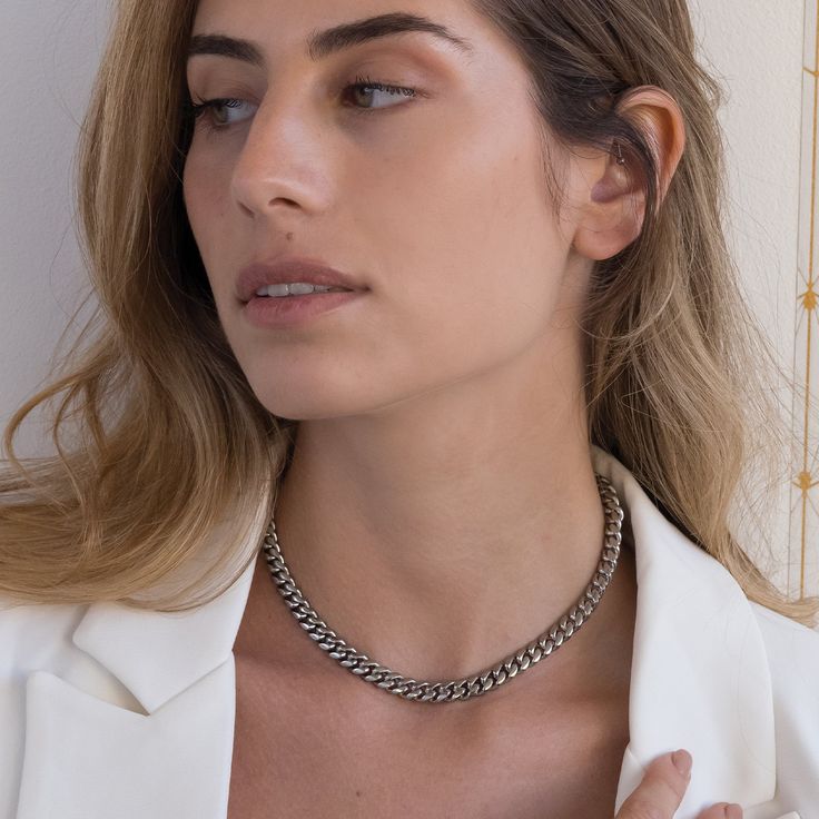 The Cuban 8mm silver chain is the essence of edgy style. A choker style chain that goes with anything, the stainless steel Cuban is the only necklace you'll ever need - but it's also the best layering piece you could want to add to your collection! Trendy Stainless Steel Jewelry With Silver Chain, Sterling Silver Chunky Cuban Link Necklace, Silver Cuban Link Necklace For Everyday, Minimalist Cuban Link Necklace With Adjustable Chain For Everyday, Chunky Chain White Gold Jewelry For Everyday, Everyday White Gold Chunky Chain Jewelry, Silver Cuban Link Jewelry For Everyday, Everyday Silver Cuban Link Necklace In Stainless Steel, Silver Stainless Steel Cuban Link Necklace For Everyday