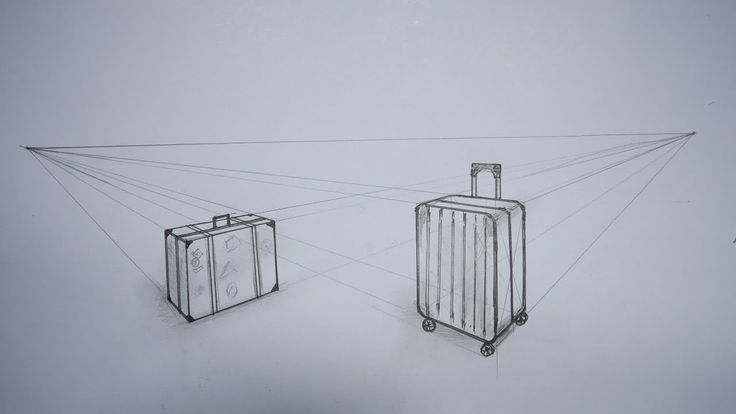 two pieces of luggage sitting on top of a snow covered ground next to each other