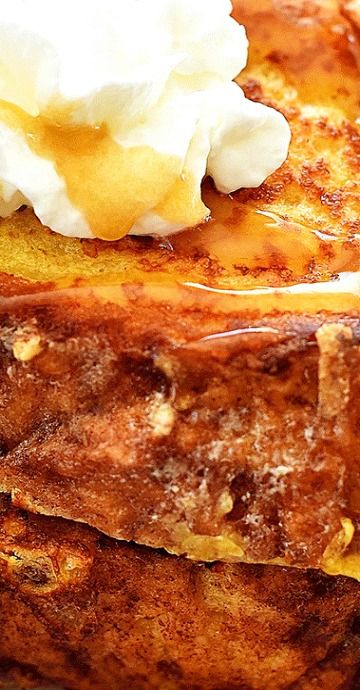 french toast topped with whipped cream and syrup