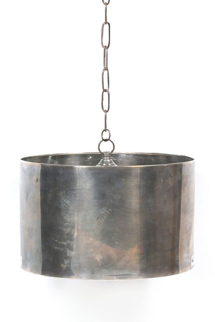 a large metal pot hanging from a chain