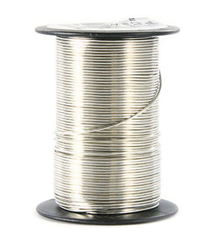 a spool of tinned wire on a white background