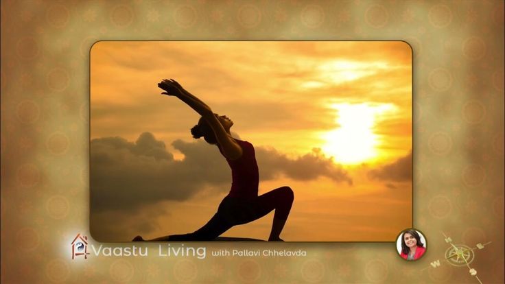 a woman is doing yoga in front of the sun