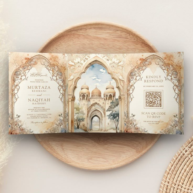 an ornate wedding card on top of a plate