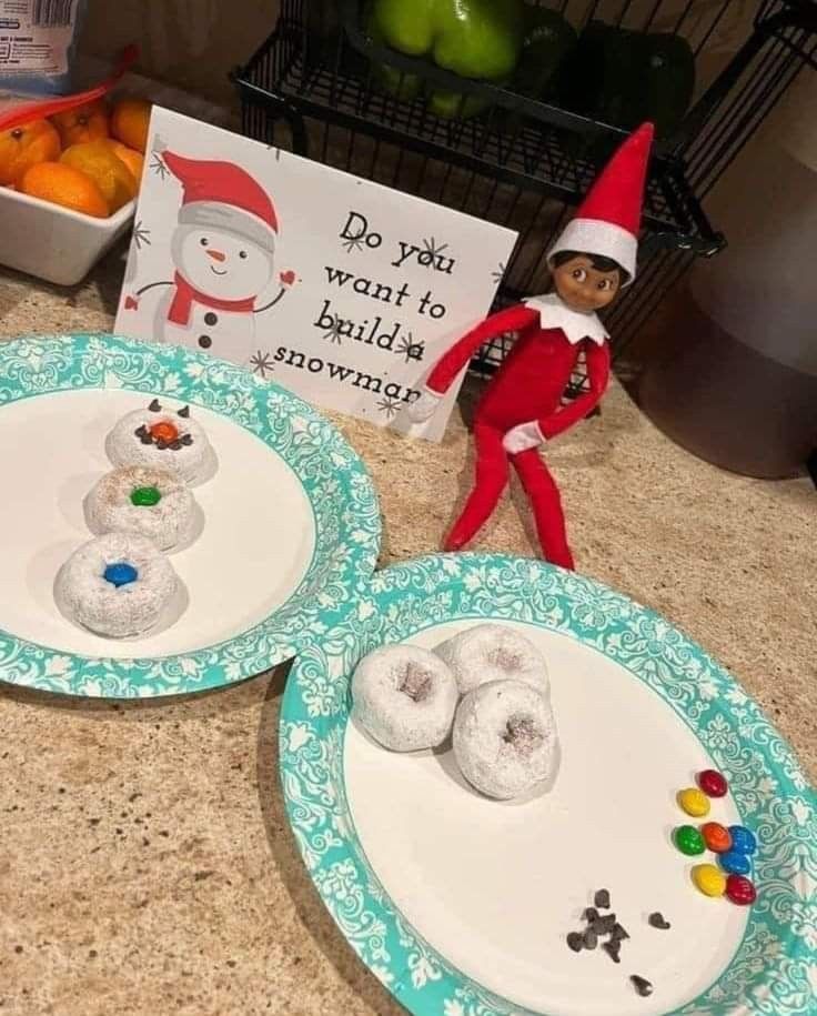 two plates with doughnuts on them and an elf