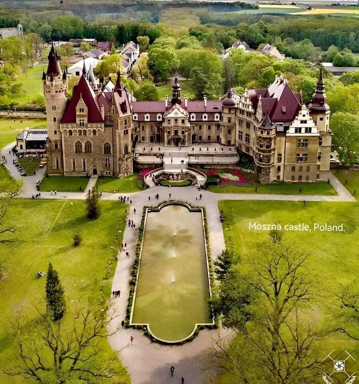 an aerial view of a large castle like building